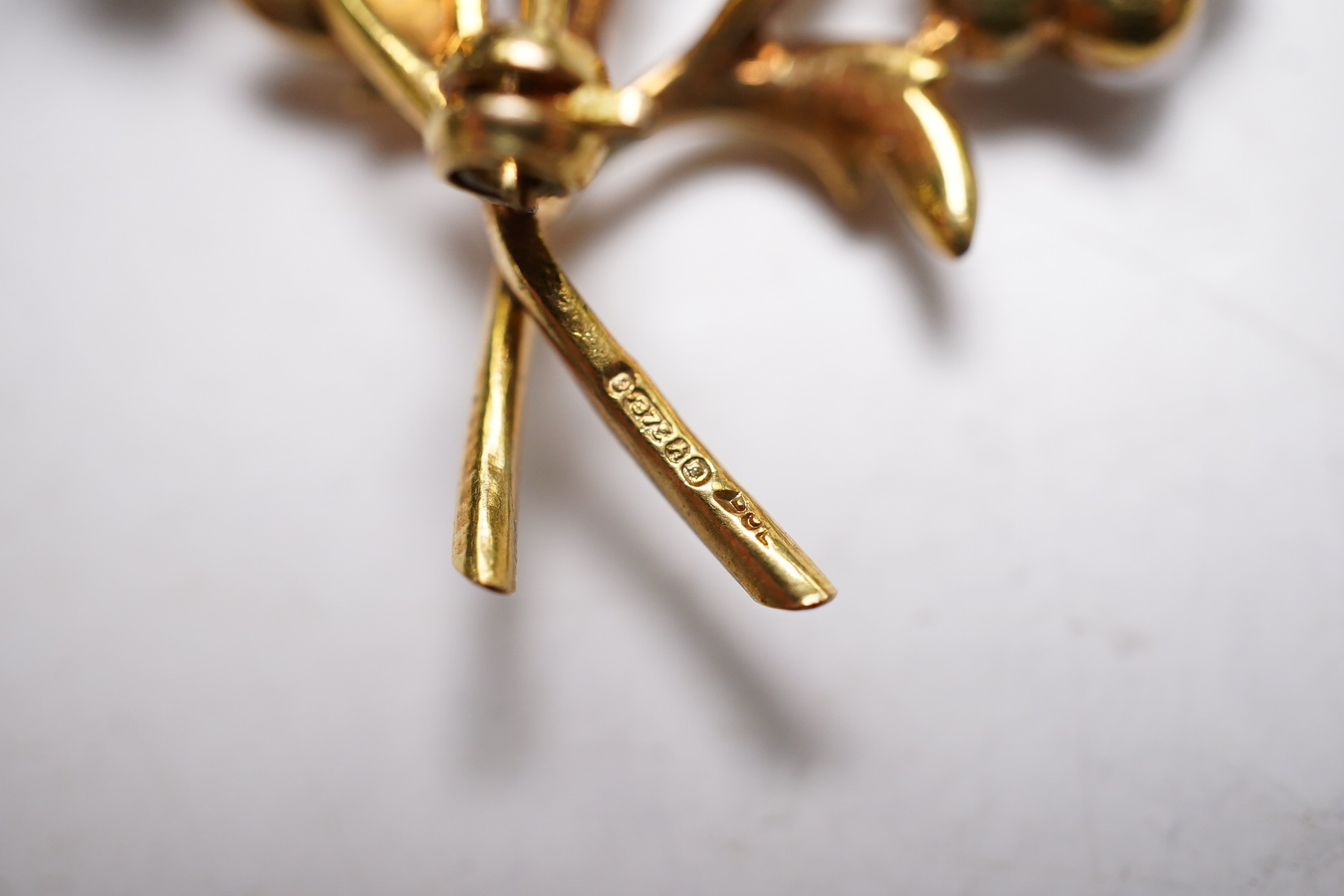 A 1960's 9ct gold, cultured pearl and garnet cluster set foliate spray brooch, 52mm (three pearls missing), gross weight 9.3 grams. Condition - poor